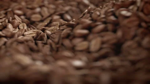 Roasted coffee beans spinning in grinder in 4K Stock Footage 163665887