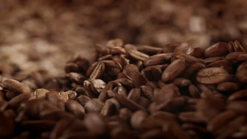 Roasted coffee beans spinning in grinder in 4K Stock Footage 163802830