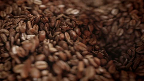 Roasted coffee beans spinning in grinder in 4K Stock Footage 164766421