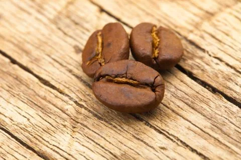 Roasted coffee beans on table - close up shot Stock Photos