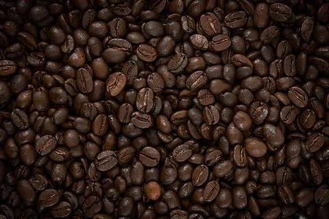 Roasted coffee beans. Texture of coffee beans. Coffee background. Can be us.. Stock Photos