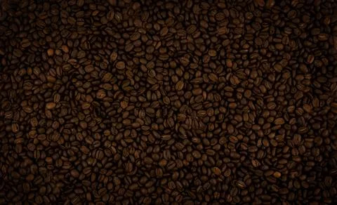 Roasted coffee beans. Texture of coffee beans. Coffee background. Stock Photos