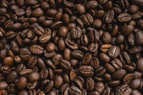 Roasted coffee beans texture creating an aromatic background for energy, fo.. Stock Photos
