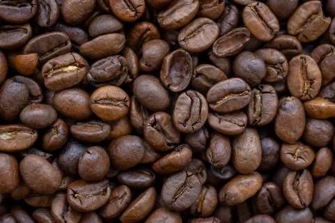 Roasted coffee beans, textured background close Фото