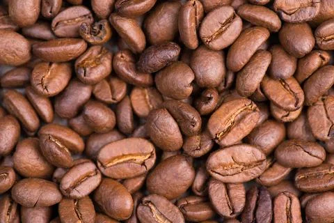 Roasted coffee beans on a textured background, empty copy space Roasted co... Stock-Fotos
