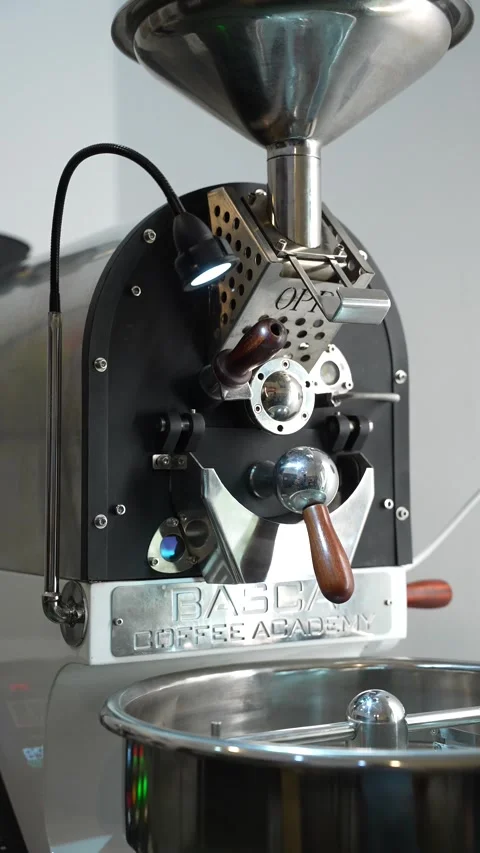 Roasted coffee beans tumbling inside a roasting drum Stock Footage 310043375