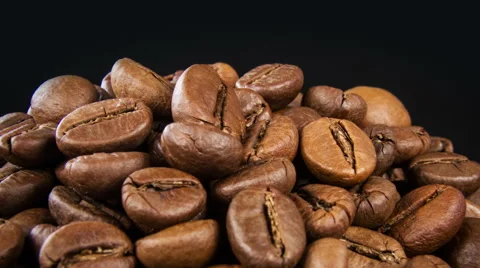 Roasted coffee beans turning background 4K Video stock 46232585