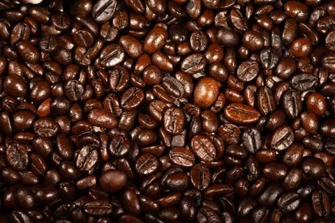 Roasted coffee beans, used as a background. Coffee beans texture. Stock Photos