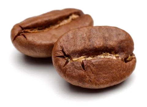 Roasted coffee beans on white background Stock Photos