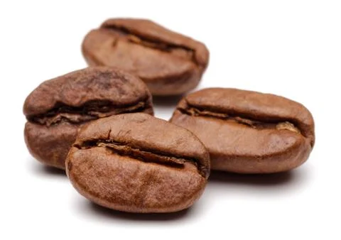 Roasted coffee beans on white background Stock Photos