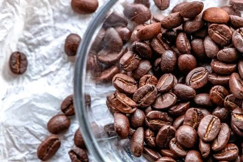 Roasted coffee beans on white background Stock Photos