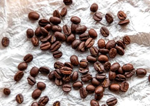 Roasted coffee beans on white background Stock Photos