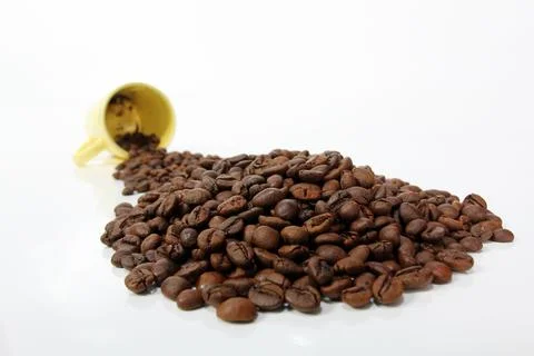 Roasted coffee beans on white background Stock Photos