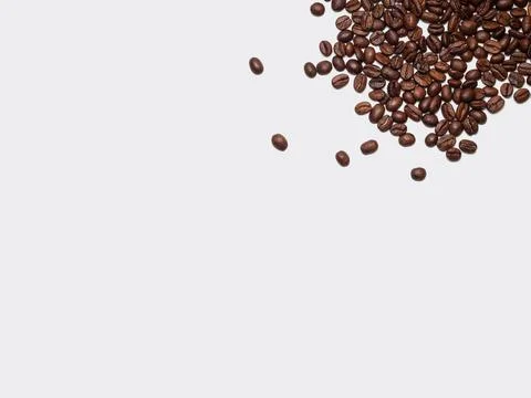 Roasted coffee beans on white background Stock Photos