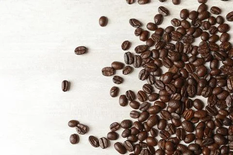 Roasted coffee beans on white background, top view 写真素材