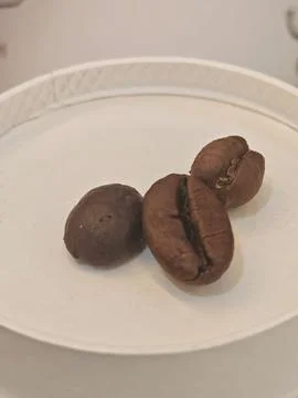 Roasted Coffee Beans on White Surface Stock Photos