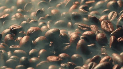 Roasted Coffee Grains. Rotating of Coffee beans with smoke, macro footage Stock Footage 134984220
