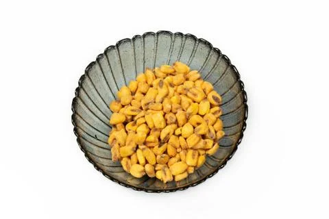 Roasted corn nuts in plate on white background Stock Photos