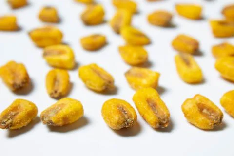 Roasted corn nuts on white background Stock Photos