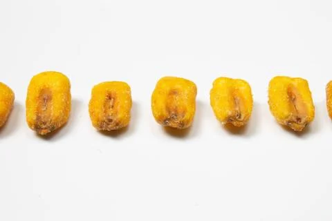 Roasted corn nuts on white background Stock Photos