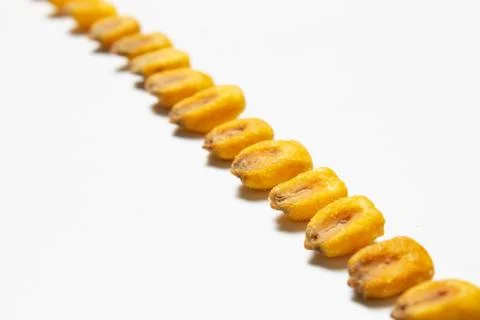 Roasted corn nuts on white background Stock Photos