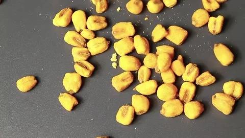Roasted corn seeds are crumbling Stock Footage 151865074