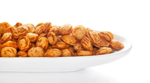 Roasted Crunchy Peanuts in a white ceramic oval bowl, made with peanuts Stock Photos
