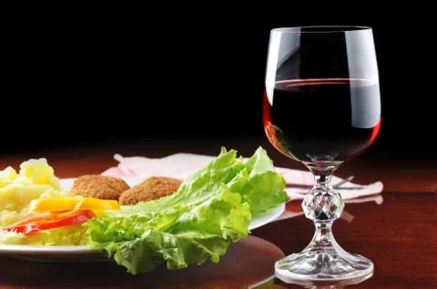 Roasted cutlets and  wine Stock Photos