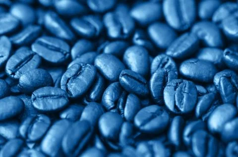 Roasted dark coffee beans background. Close up. Macro. Stock Photos