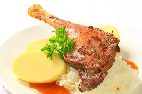 Roasted duck leg with mashed potatoes and rice Stock Photos