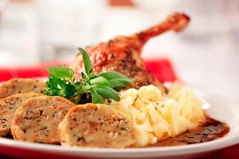 Roasted duck with sausages and mashed potatoes Stock Photos