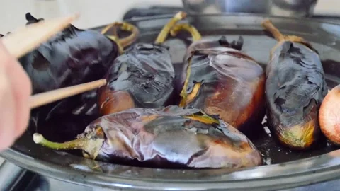 Roasted eggplant on barbecue fire,OF THE roasted eggplant appetizer as to mak Stock Footage 137764688