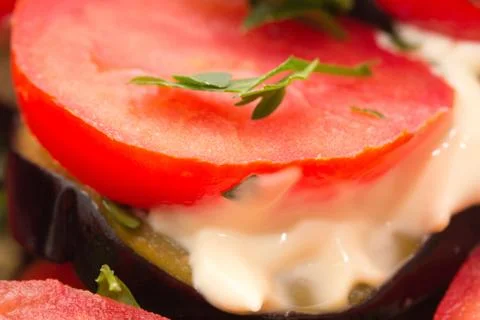 Roasted eggplant with tomatoes Stock Photos