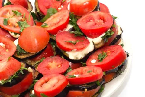 Roasted eggplant with tomatoes Stock Photos