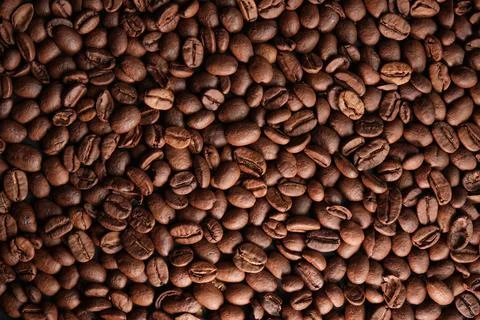 Roasted fragrant coffee beans background Stock Photos