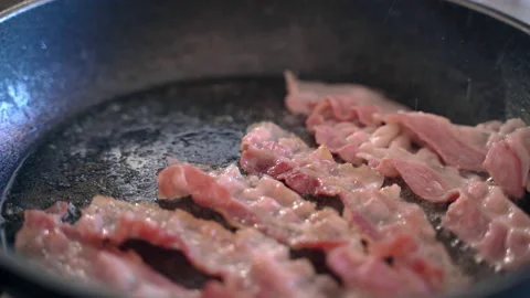 Roasted fresh bacon strips on hot pan wih sizzling oil, process of meat slices Vídeos de archivo 156087906