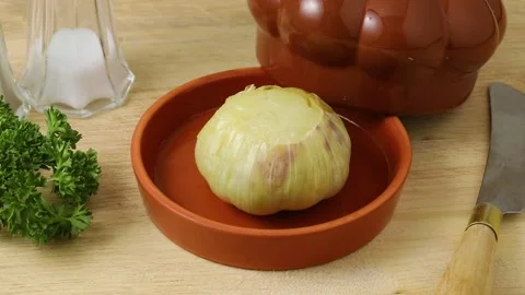 Roasted garlic in a ceramic bowl Stock Footage 172142401