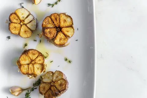 Roasted garlic with thyme with copy space 写真素材