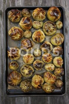 Roasted Green Heirloom Tomatoes on a Sheet Pan Stock Photos