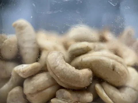 Roasted ground cashews inside a plastic jar Stock Photos