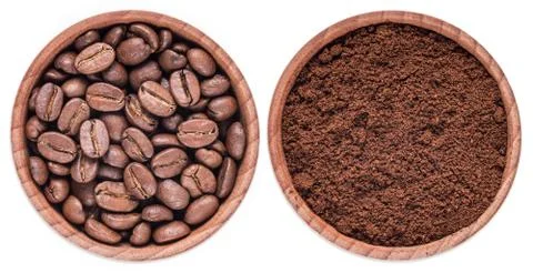 Roasted ground coffee, beans isolated on a white background in a wooden bowl. Stock Photos