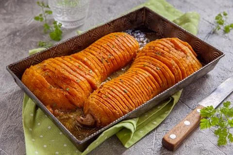 Roasted hasselback butternut squash pumpkin Stock Photos