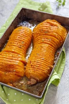 Roasted hasselback butternut squash pumpkin Stock Photos