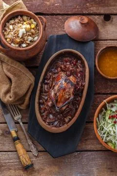 Roasted Hazel Grouse meat with buckweat porridge and cranberry sauce Stock Photos