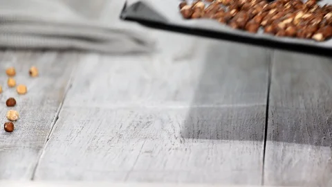 Roasted hazelnuts on a baking sheet. Stock Footage 102900700