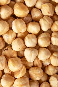Roasted hazelnuts closeup, shelled nuts background, healthy snack Stock Photos