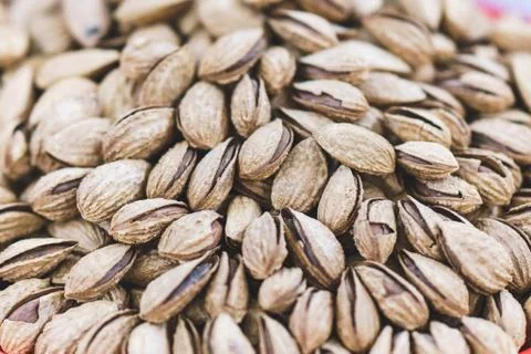 Roasted inshell almonds close up Stock Photos