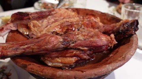 Roasted lamb on a dining table Stock Footage 297082079