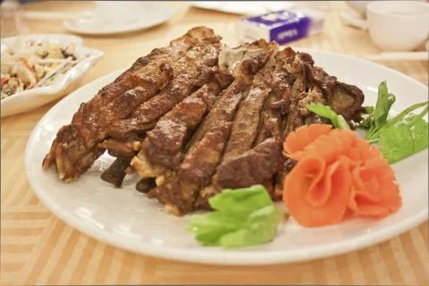 Roasted lamb on dishes Foto stock