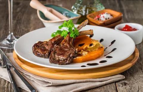 Roasted lamb ribs with  grilled pumpkin Stock Photos